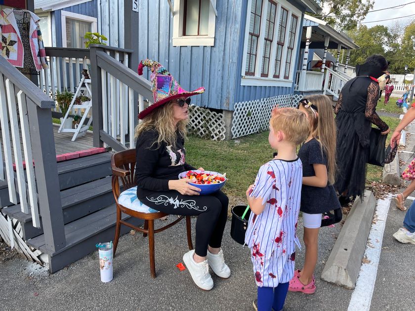 Quilt Shop owner Patty Roebuck hands out candy to the kids