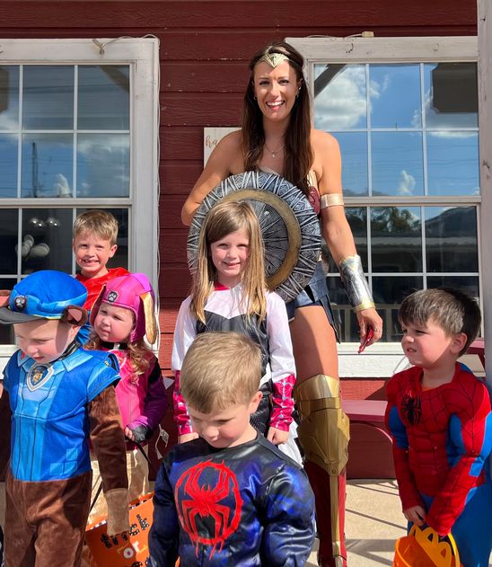 Sharon Graff (Wonder Woman) owner of the Modern Skein, after handing out candy to some happy kids  