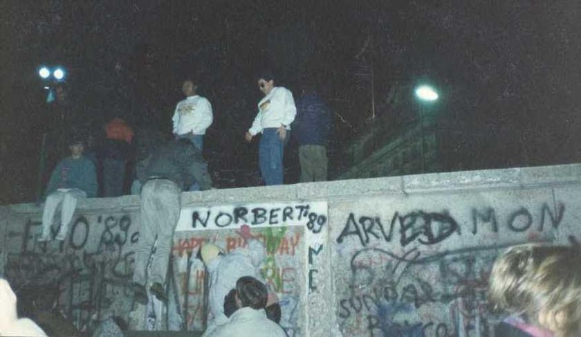 Ruben, in the middle, standing on The Berlin Wall at the Brandenburg Gate just days after November 9th, 1989