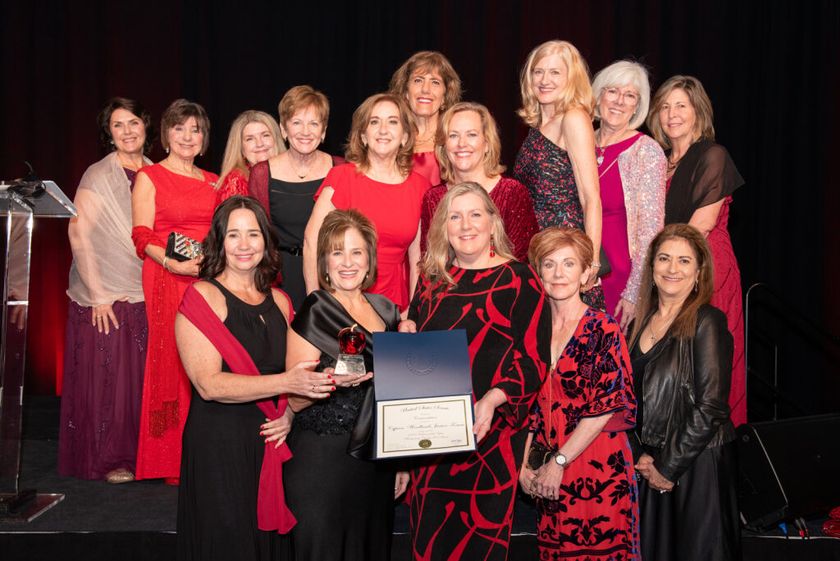 Members of the Cypress-Woodlands Junior Forum celebrate their 2025 Volunteer of  the Year award with President Amy Terry (front row, second from the left).